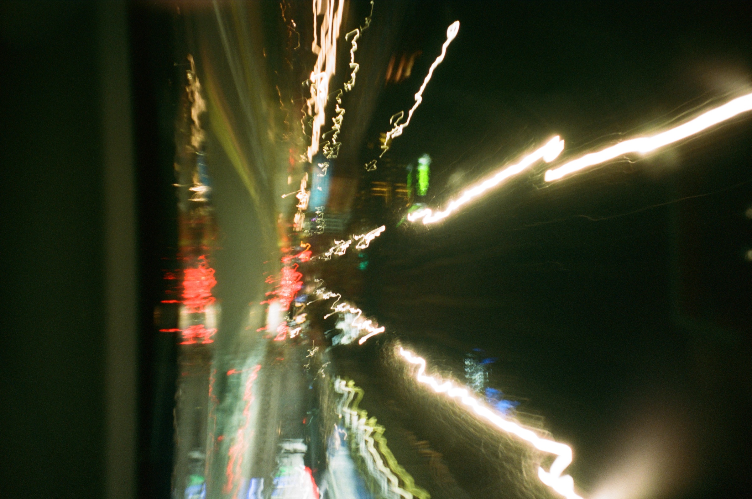 Night traffic lights from a moving car
