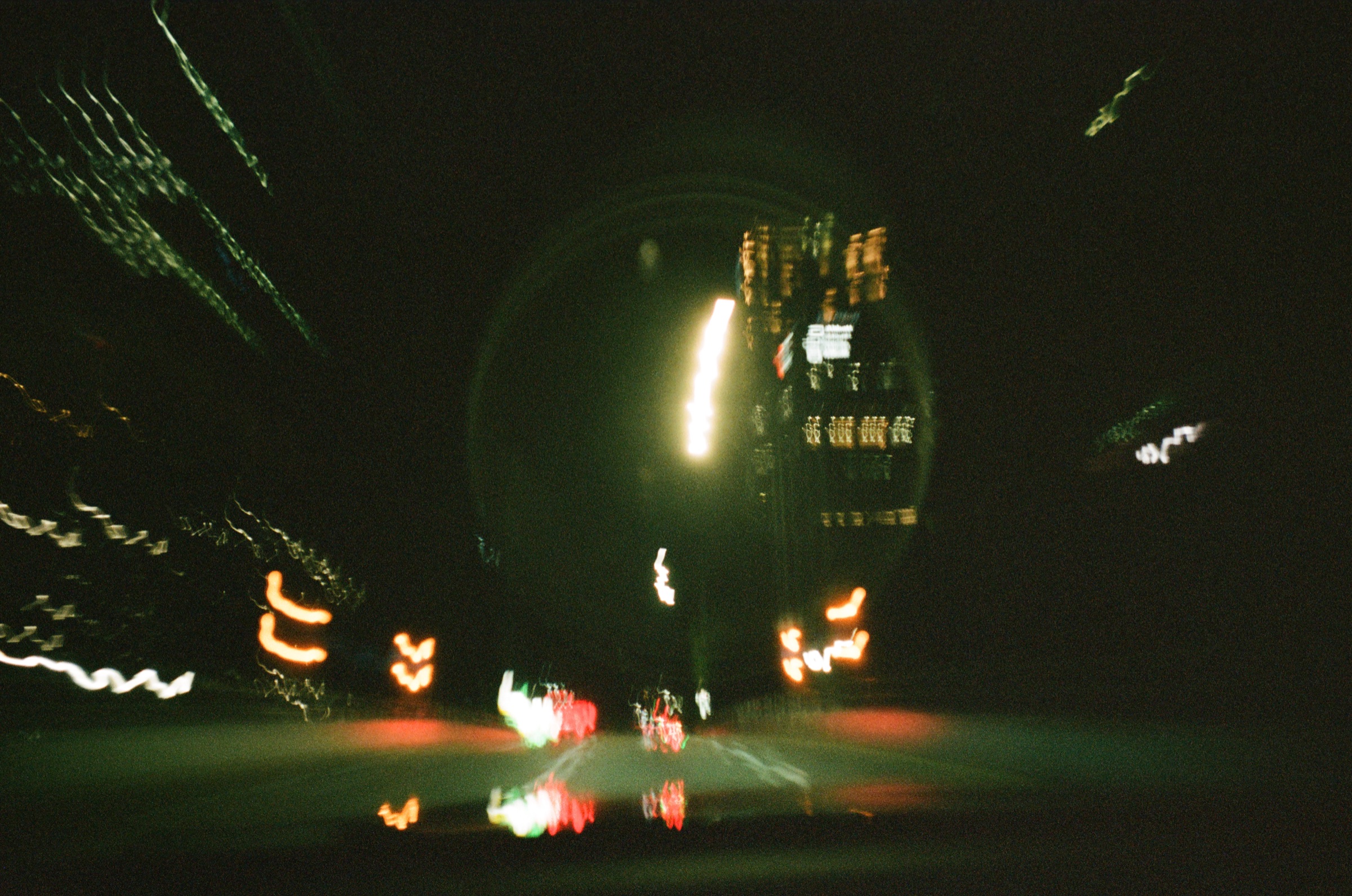 Night city street with blurred car lights