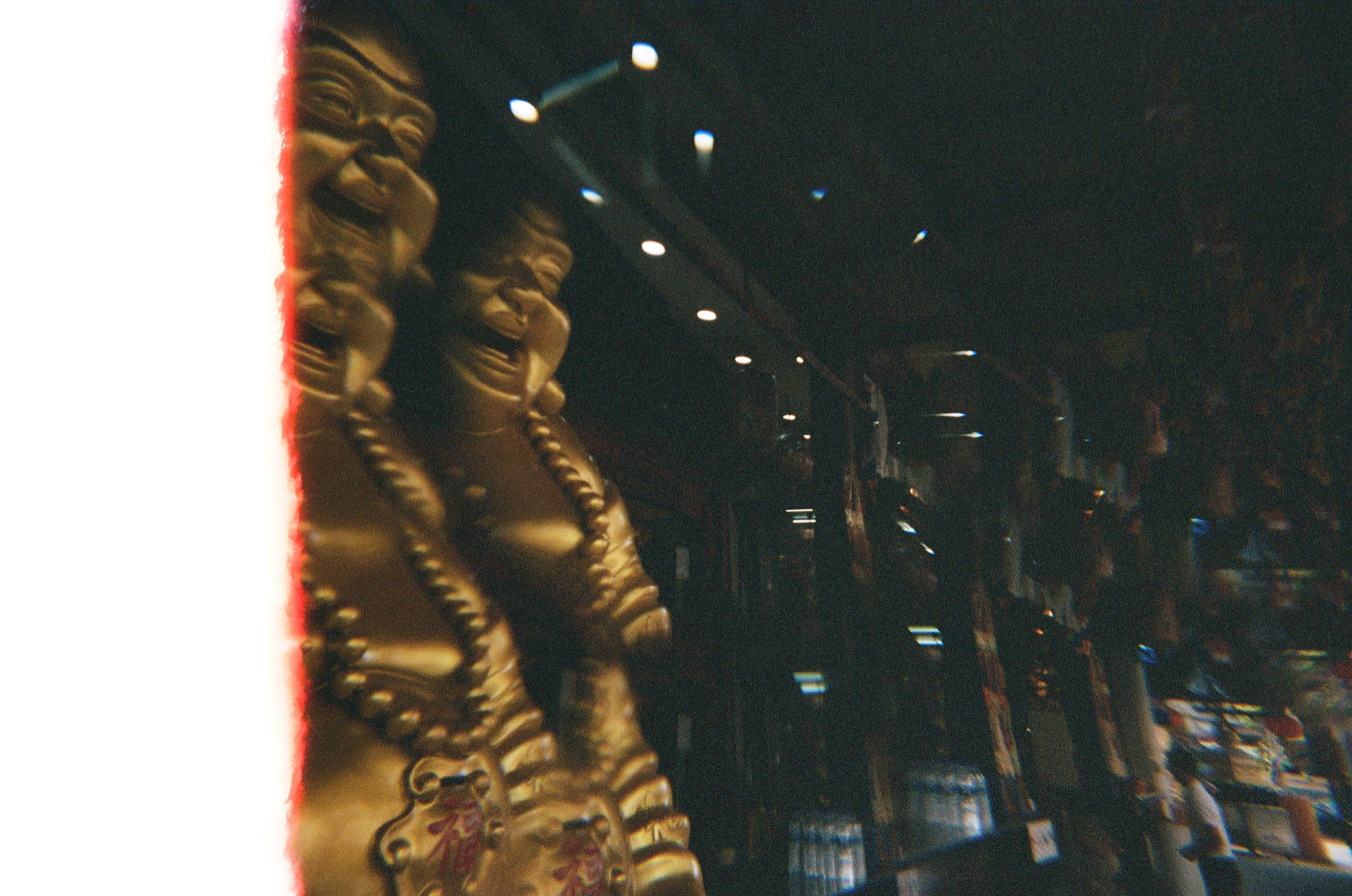 Temple statues with a light leak